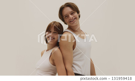 Joyful couple with radiant skin laughing under soft natural light Joyful couple with radiant skin laughing under soft natural light 131959418