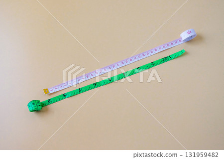 White and Green Measuring tape on color background. 131959482