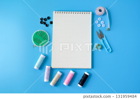 Sewing accessories and supplies tools with book note. 131959484