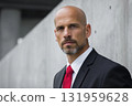 Confident Man in Black Suit With Red Tie Stands Against Minimalist Backdrop Generative AI 131959628