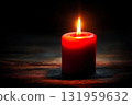 Warm Glow of a Red Candle Flame Illuminating the Darkness at Night Generative AI 131959632