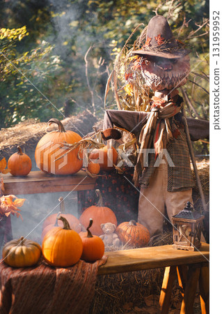 Autumn Harvest Scene with Scarecrow and Pumpkins 131959952