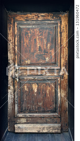 Old wooden door showing distressed rustic texture Old wooden door showing distressed rustic texture 131960472