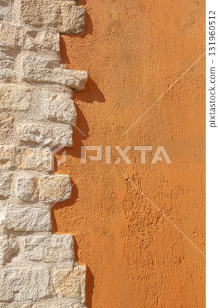 Stone brick wall contrasting orange plaster texture Stone brick wall contrasting orange plaster texture 131960512