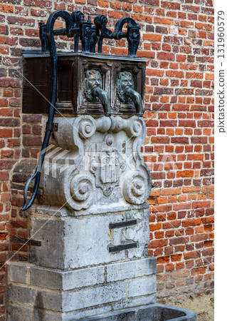 Old water pump in Groot Begijnhof Leuven Old water pump in Groot Begijnhof Leuven 131960579