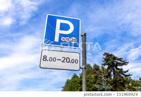 Paid parking road sign against the sky 131960929