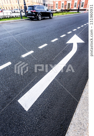 Traffic sign white arrows on asphalt road close up 131960931