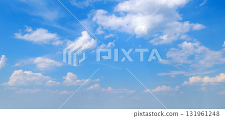 Blue Sky Background with Scattered Cumulus Clouds Blue Sky Background with Scattered Cumulus Clouds 131961248