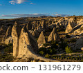 Strange rock formations illuminated by the morning sun in Cappadocia, Turkey 131961279