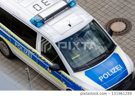 Top above view of german police van car parked on city street police station parking on sunny day. Civil emergency law authority  security and traffic service vehicle in Europe 131961289