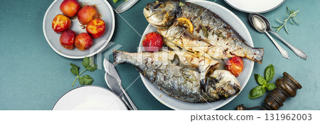Yummy baked dorado fish, food photography. 131962003