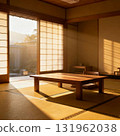 Warm morning light pours into the Japanese-style room with tatami mats, shoji screen doors and a low table. Warm morning light pours into the Japanese-style room with tatami mats, shoji screen doors and a low table. 131962038