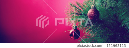 Red Christmas Balls on Christmas Tree on Red Background Red Christmas Balls on Christmas Tree on Red Background 131962113