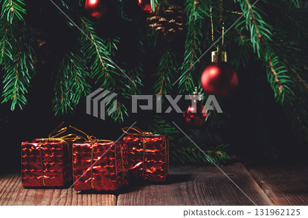 Red gifts under the Christmas tree 131962125