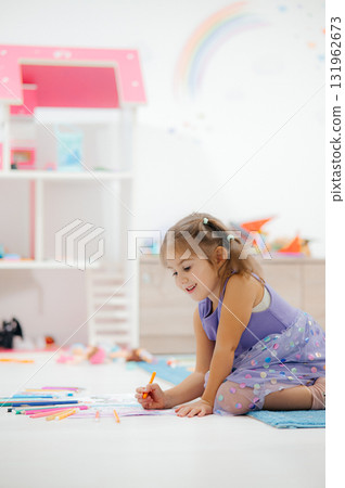 A Creative Child Engaged in a Fun and Colorful Coloring Activity in the Playroom Environment 131962673