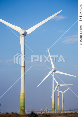 White wind turbines stand on the coast White wind turbines stand on the coast 131962980