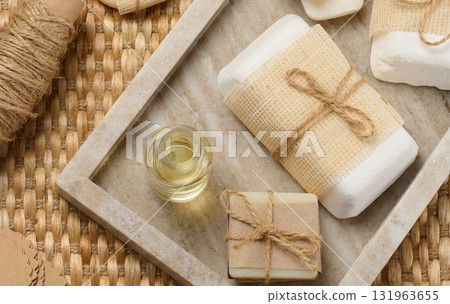 Pieces of handmade soap on a marble stand 131963655
