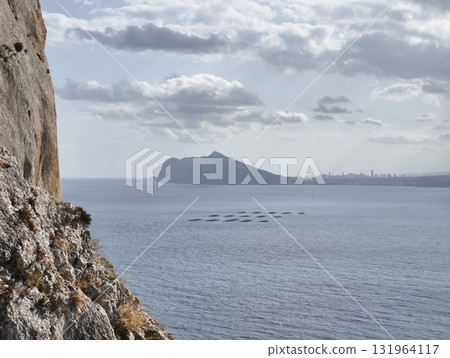 Experience a breathtaking, scenic seascape that features a stunning coastal mountain view 131964117