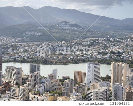 Breathtaking Aerial Viewshowcasing Cityscape Nestled Amidst Majestic Mountain Ranges Breathtaking Aerial Viewshowcasing Cityscape Nestled Amidst Majestic Mountain Ranges 131964121