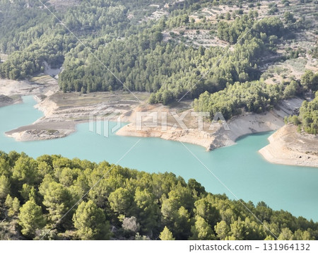 A Serene and Peaceful Landscape of a Beautiful Reservoir Surrounded by Lush Greenery A Serene and Peaceful Landscape of a Beautiful Reservoir Surrounded by Lush Greenery 131964132