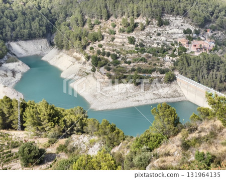 The Serene Reservoir is beautifully Surrounded by Lush Greenery and Scenic Landscapes 131964135