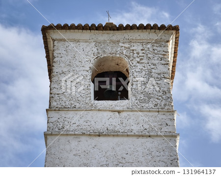 A Historic Bell Tower Stands Majestically Against a Blue Sky, Highlighting Its Beauty 131964137