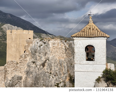 The Historic Castle along with its Bell Tower is beautifully surrounded by magnificent Mountains 131964138