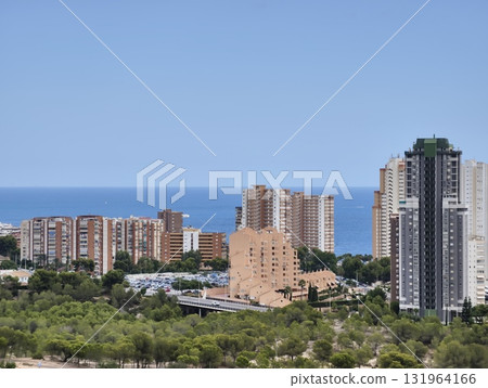 A stunning coastal cityscape that beautifully overlooks the vast expanse of the sea A stunning coastal cityscape that beautifully overlooks the vast expanse of the sea 131964166