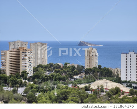 A picturesque scenic coastal view that showcases a vibrant urban landscape alongside the blue ocean A picturesque scenic coastal view that showcases a vibrant urban landscape alongside the blue ocean 131964170