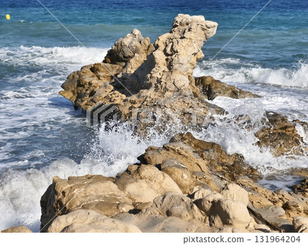 Breathtaking and Scenic Rocky Seashore with Waves Crashing Against the Rugged Coastline Breathtaking and Scenic Rocky Seashore with Waves Crashing Against the Rugged Coastline 131964204