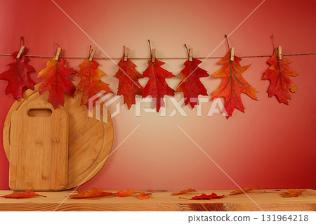 Empty wooden product display table with maple leaves on kitchen background, minimalist autumn concept, creative autumn composition and banner for display. Happy Thanksgiving greeting card 131964218