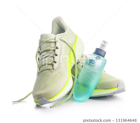 Sport running shoes and water bottle  isolated on white background. 131964648