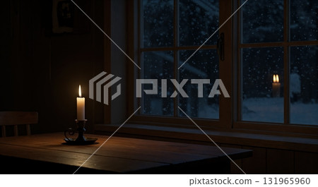 A glowing candle in a vintage holder illuminates a dark wooden table beside a window, revealing falling snow and a distant reflection on a cold winter night. 131965960