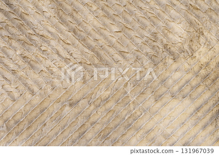 Wall background surface with diagonal folds forming abstract textured background. Concept of imperfection, creative roughness, and eco-friendly material design Wall background surface with diagonal folds forming abstract textured background. Concept of imperfection, creative roughness, and eco-friendly material design 131967039
