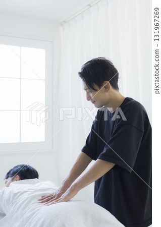 Man receiving chiropractic treatment Man receiving chiropractic treatment 131967269