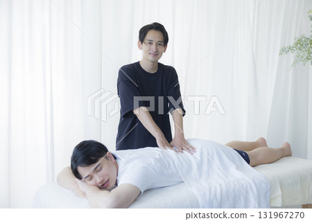 Man receiving chiropractic treatment 131967270
