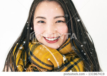 Portrait of a young woman wearing a scarf 131967419