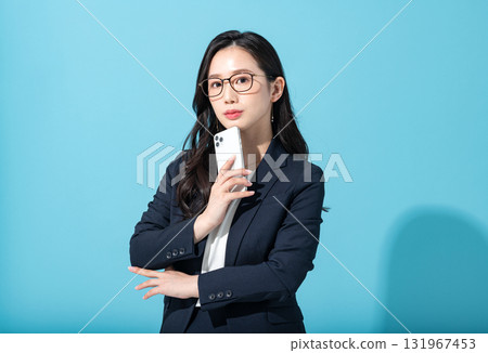 A young career woman with a smartphone 131967453