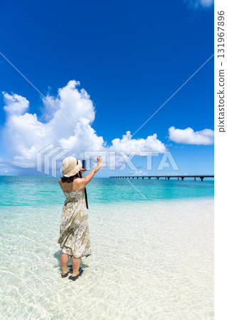 Summer clouds and emerald beach resort Summer clouds and emerald beach resort 131967896