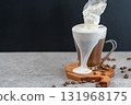 Viennese coffee cream spilling out of the cup 131968175