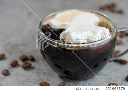 Viennese coffee (Einspänner) poured into a cup 131968179