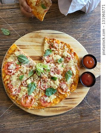 This is round of pizza on the table This is round of pizza on the table 131968771