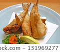 The delicious aroma fills your mouth. A photo of golden fried small puffer fish. 131969277