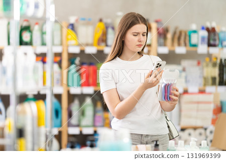 Girl buyer scans qr code on razor kit label 131969399