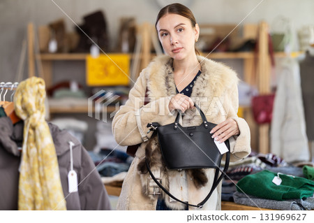 woman in the top one chooses a bag 131969627