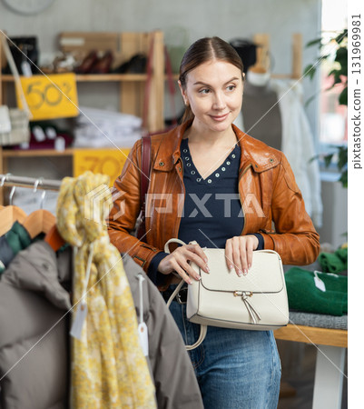 woman in the top one chooses a bag woman in the top one chooses a bag 131969981