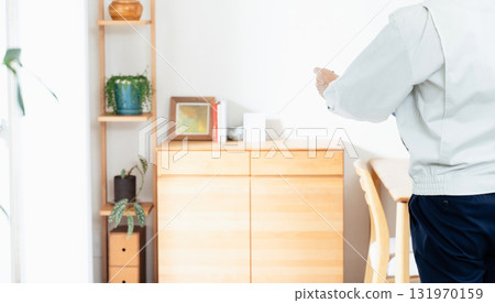A man in work clothes checking furniture 131970159