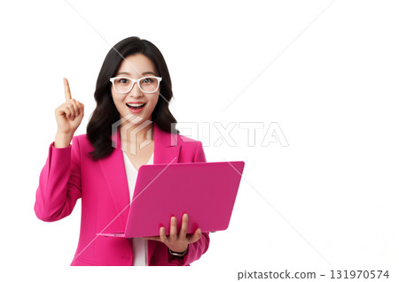 asian woman in a pink suit and glasses holds a pink laptop, pointing a finger up 131970574