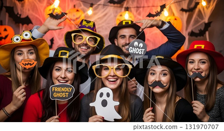 Group of friends celebrating Halloween with props and costumes Group of friends celebrating Halloween with props and costumes 131970707