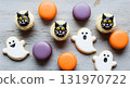 Festive Halloween Treats Macarons, Ghost Cookies, and Black Cat Cupcakes 131970722